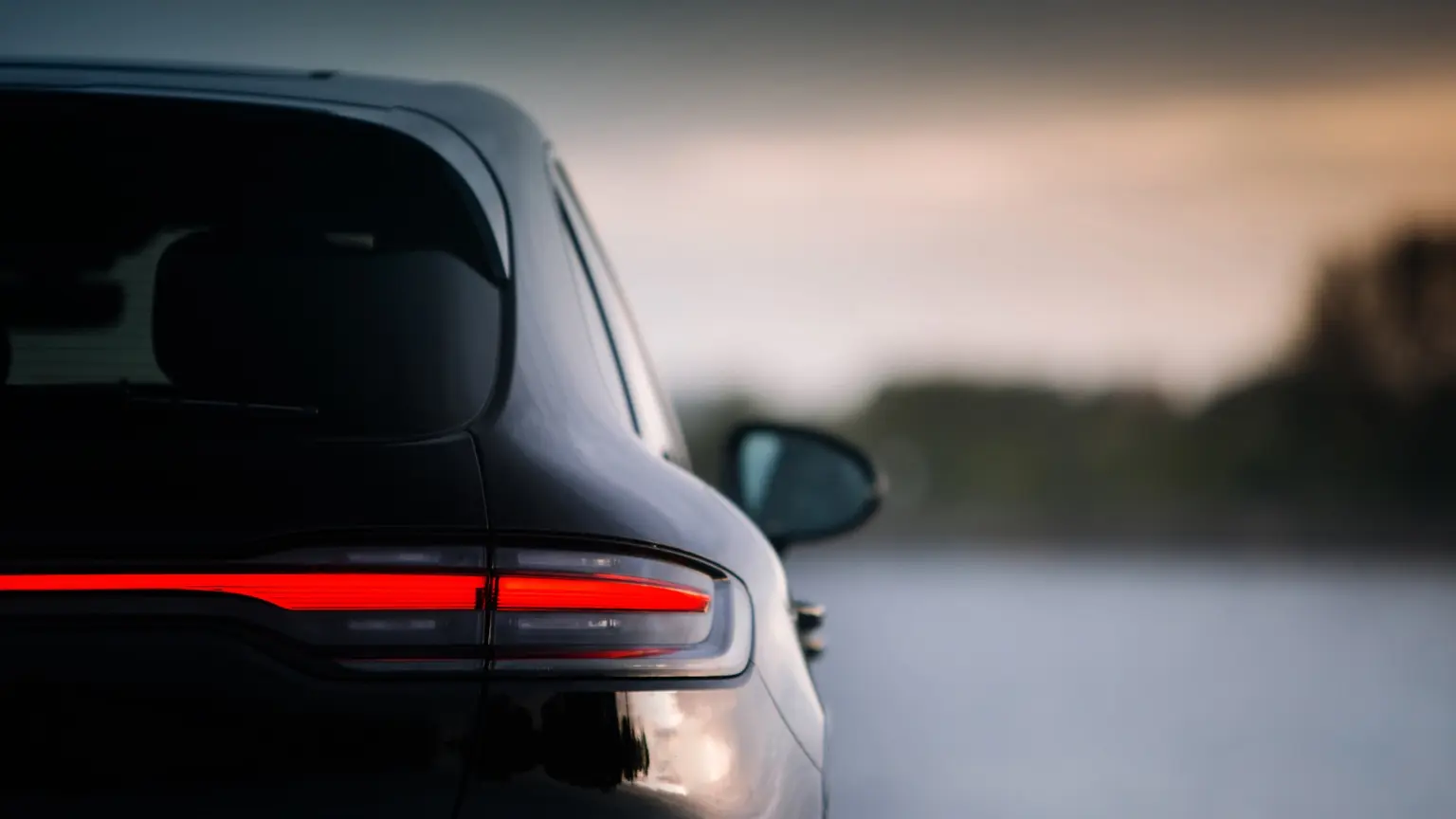 Modern dark crossover viewed from the rear