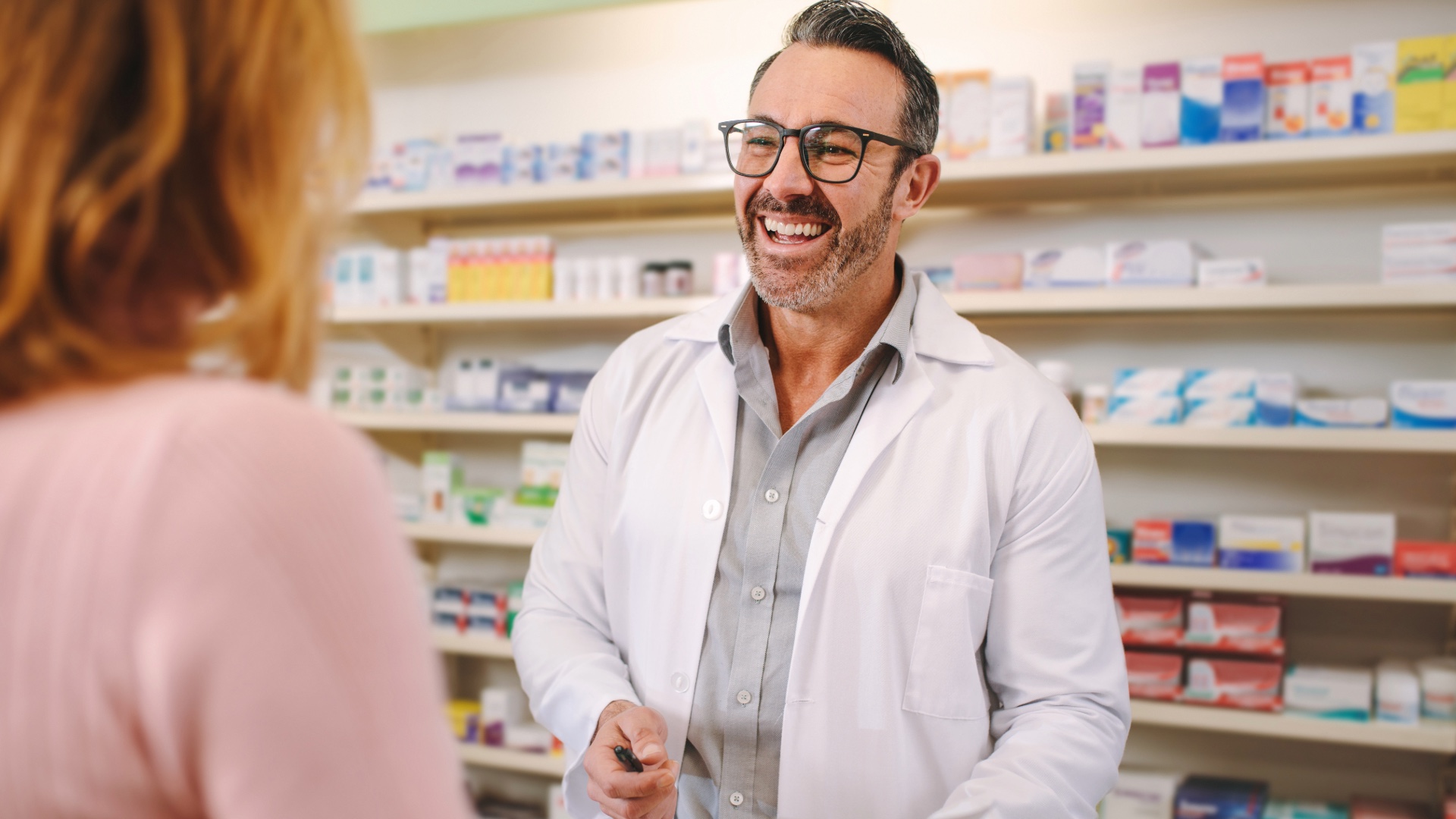Pharmacist assisting a customer