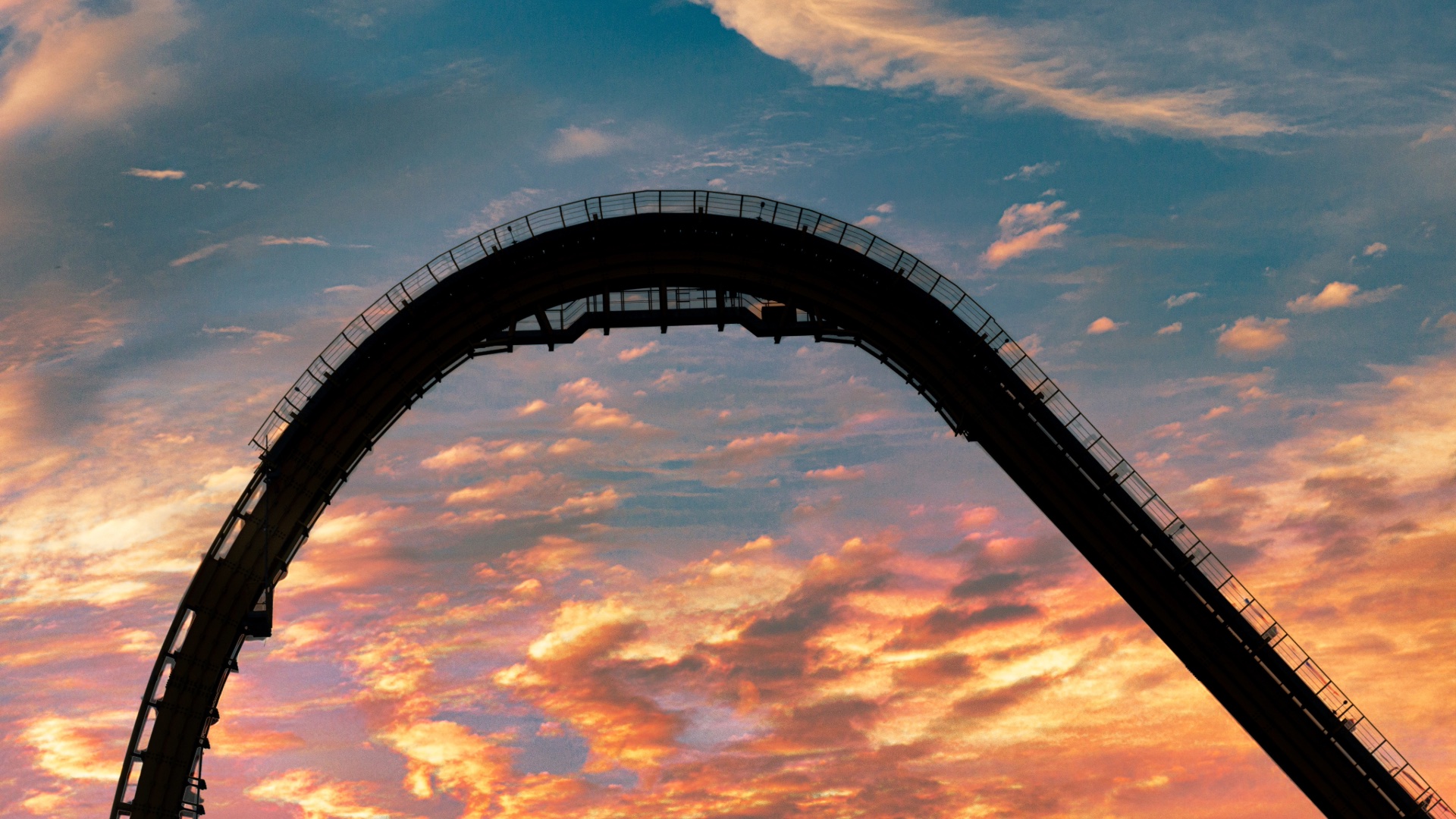 Skyrush roller coaster silhouetted against a sunset sky in Hershey, Pennsylvania