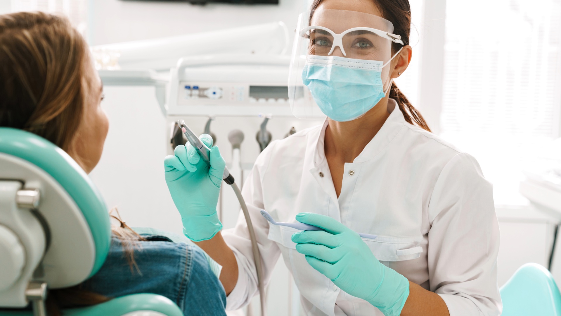 Female dentist preparing for a patient's exam