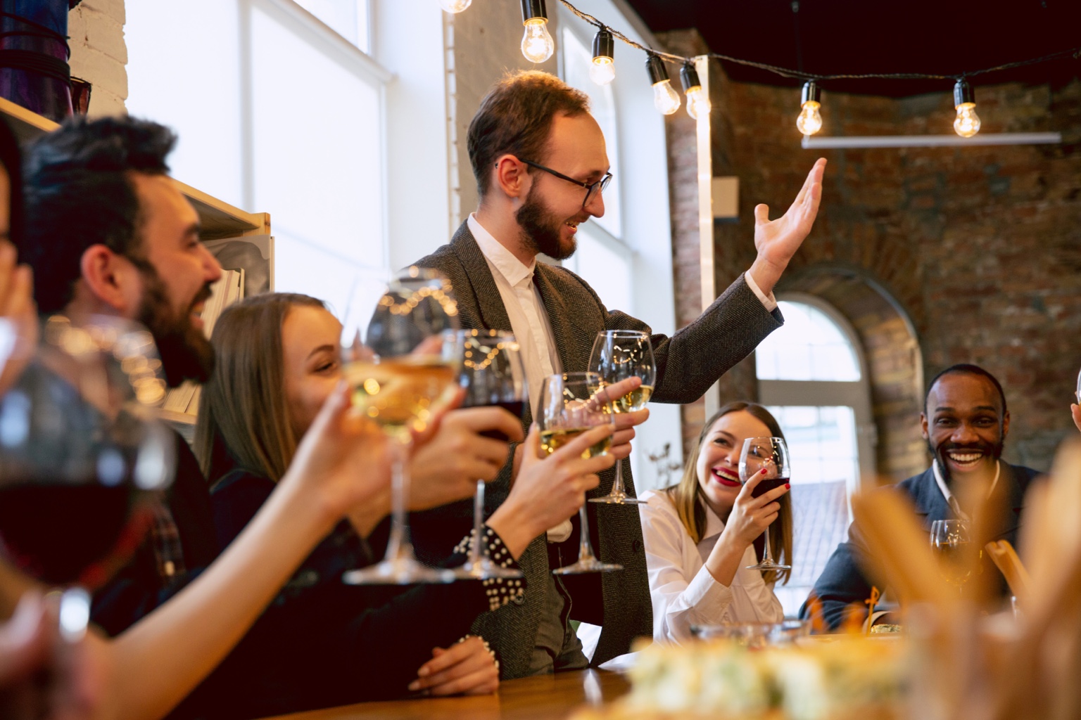 Guests raising glasses during an indoor special event