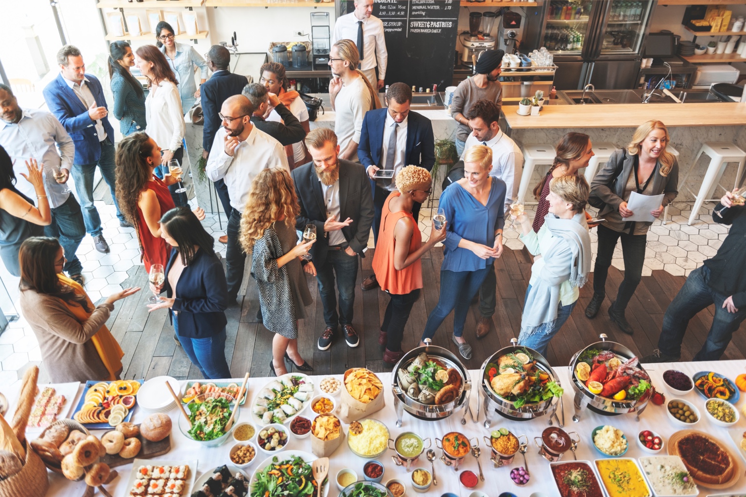 Guests socializing beside a buffet at a special event