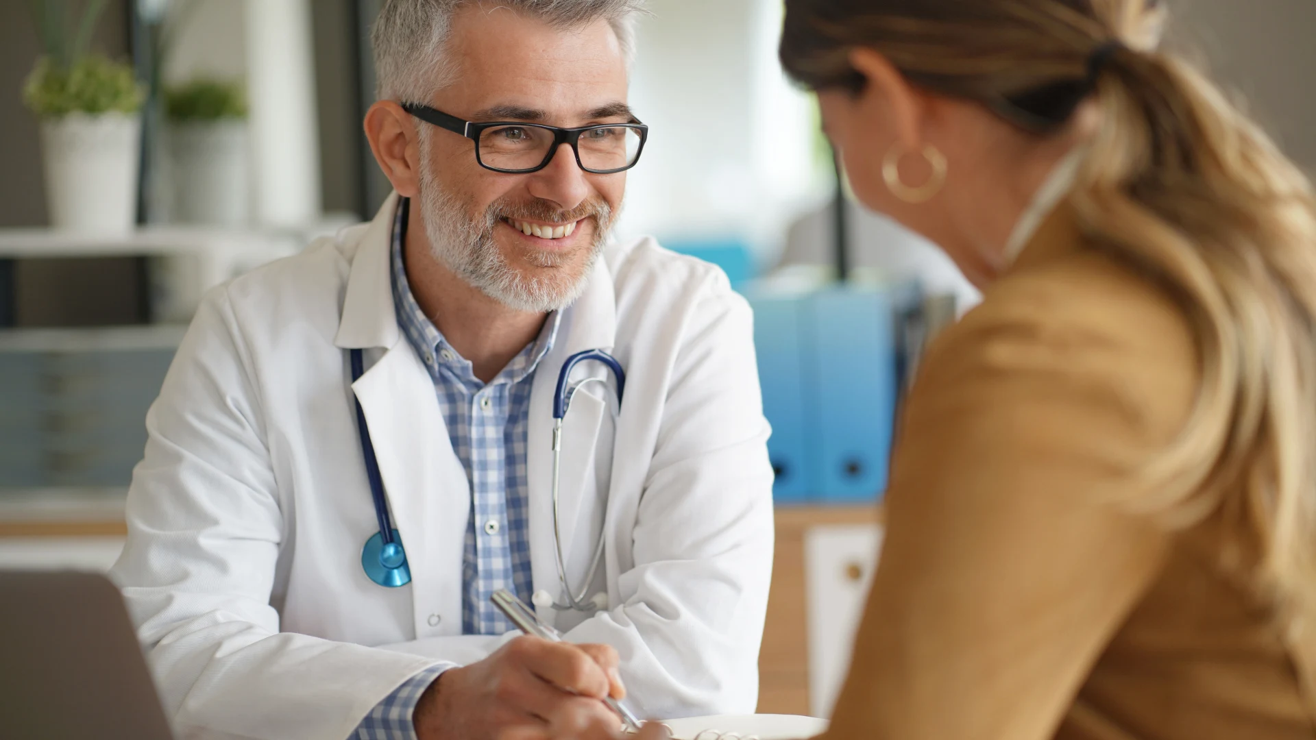 Doctor consulting with a woman during an office visit