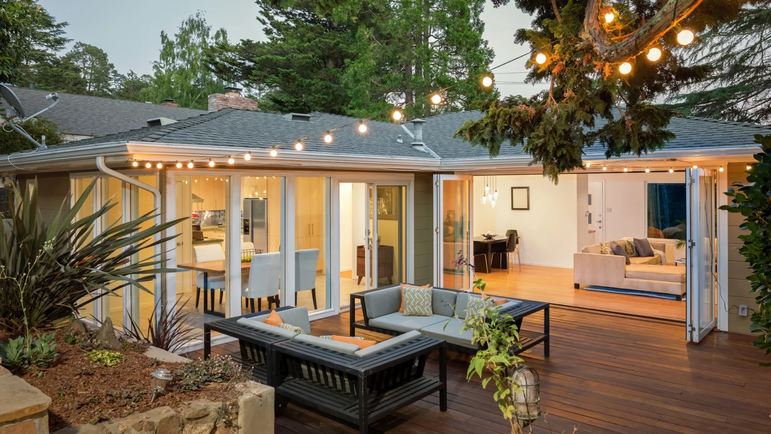 Inviting home patio and open living space with string lights