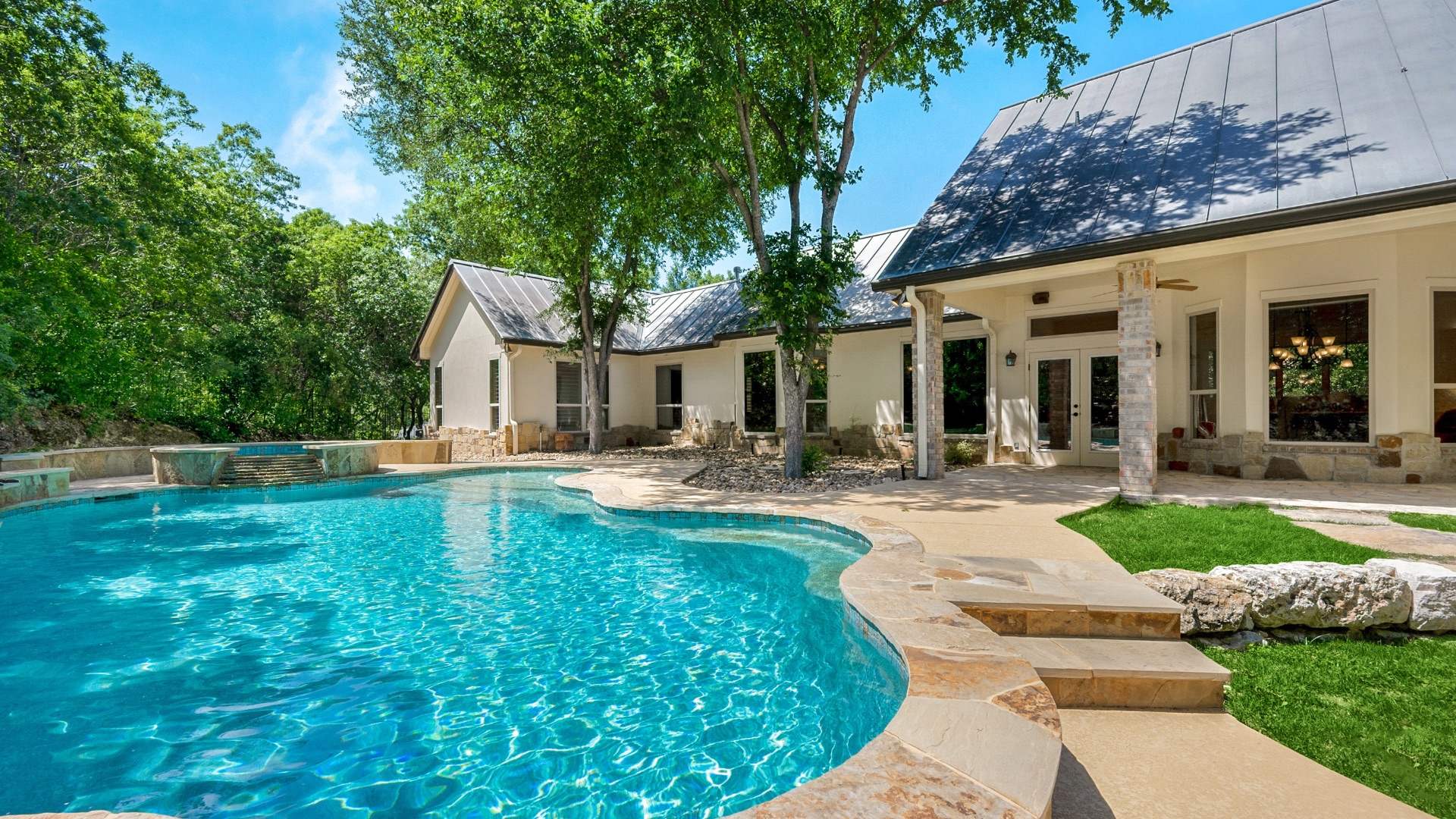 Luxury home with a backyard swimming pool