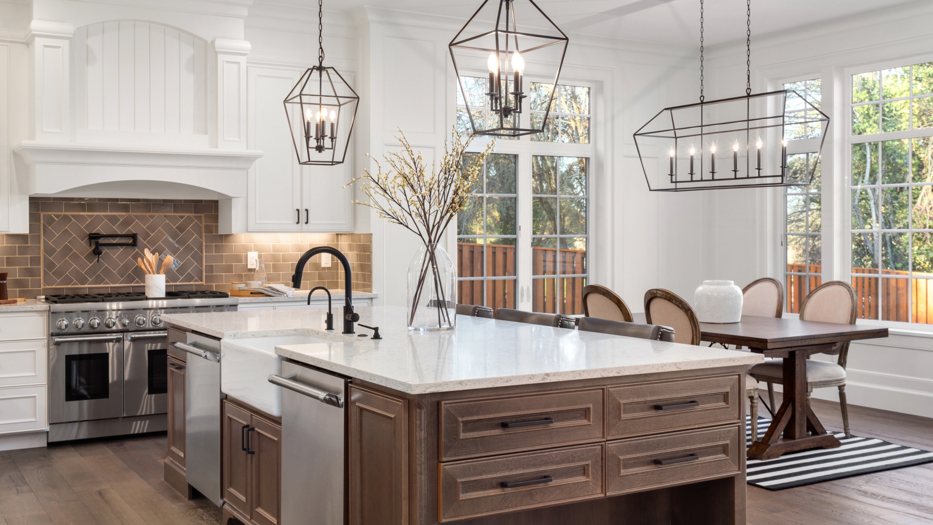 Bright luxury kitchen with a large island and statement lighting