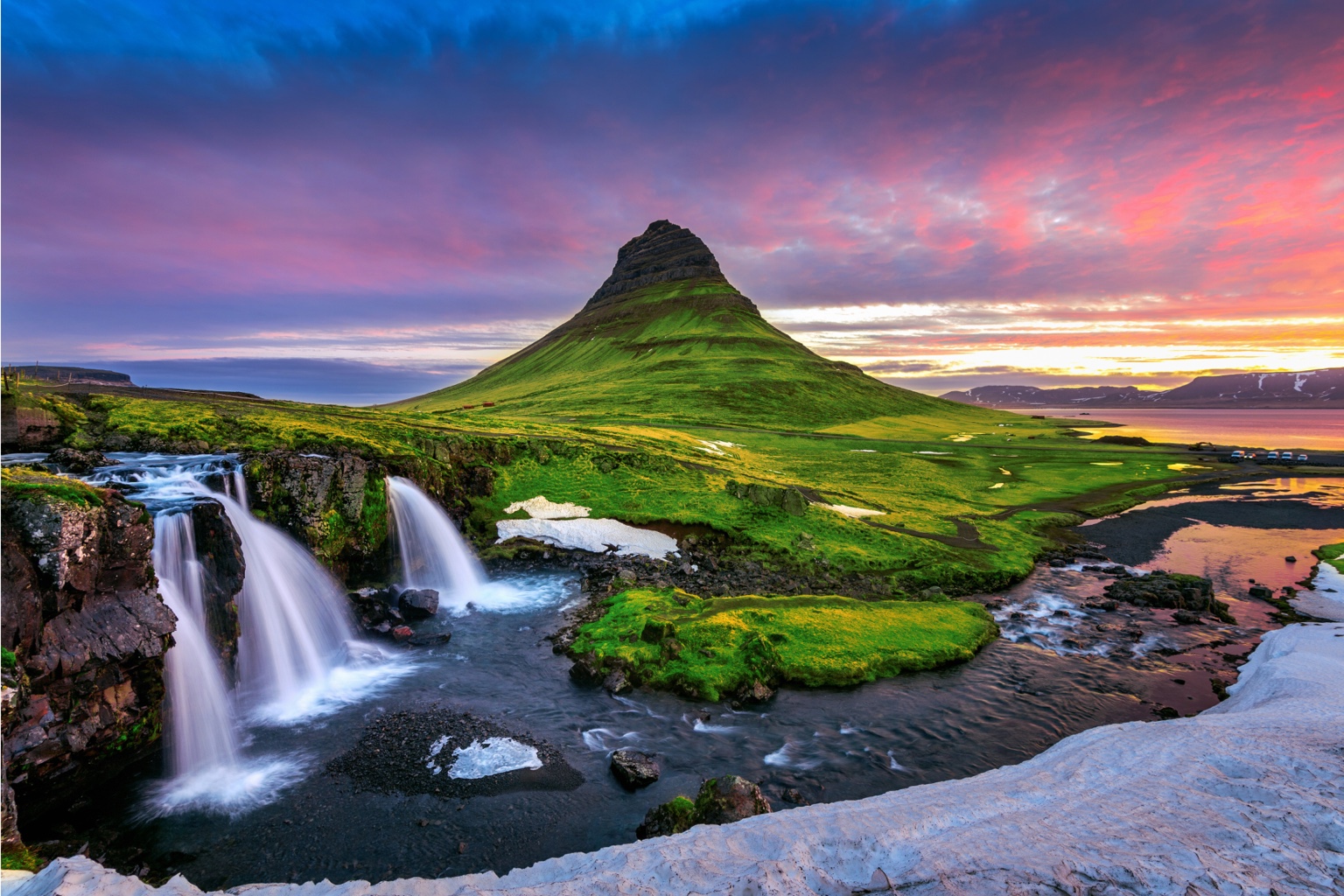 Kirkjufell mountain and waterfalls at sunset in Iceland