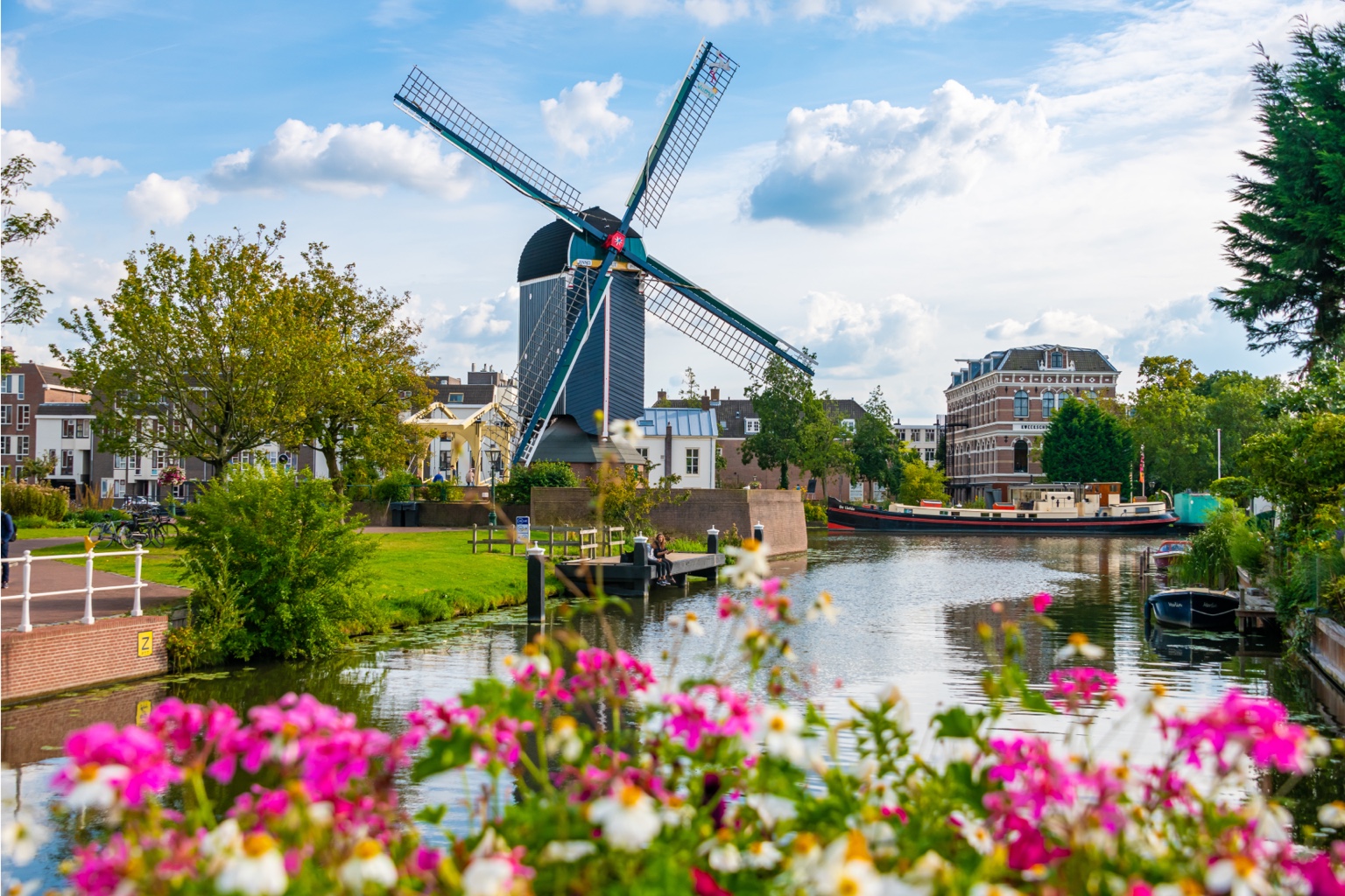 Historic windmill beside a canal in the Netherlands