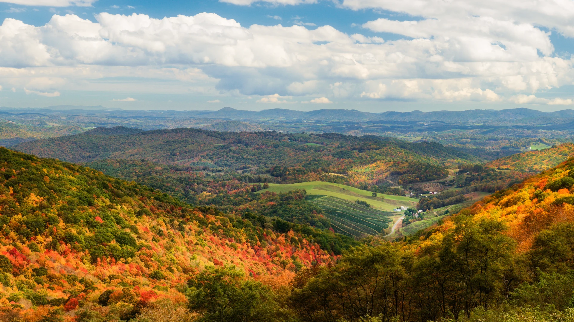 Autumn foliage at Grayson Highlands overlooking farms in a Virginia valley
