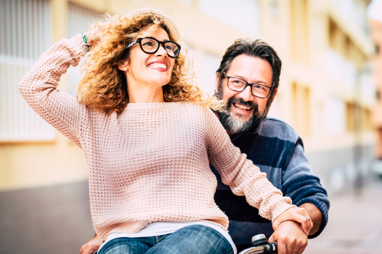 Smiling couple wearing eyeglasses outdoors