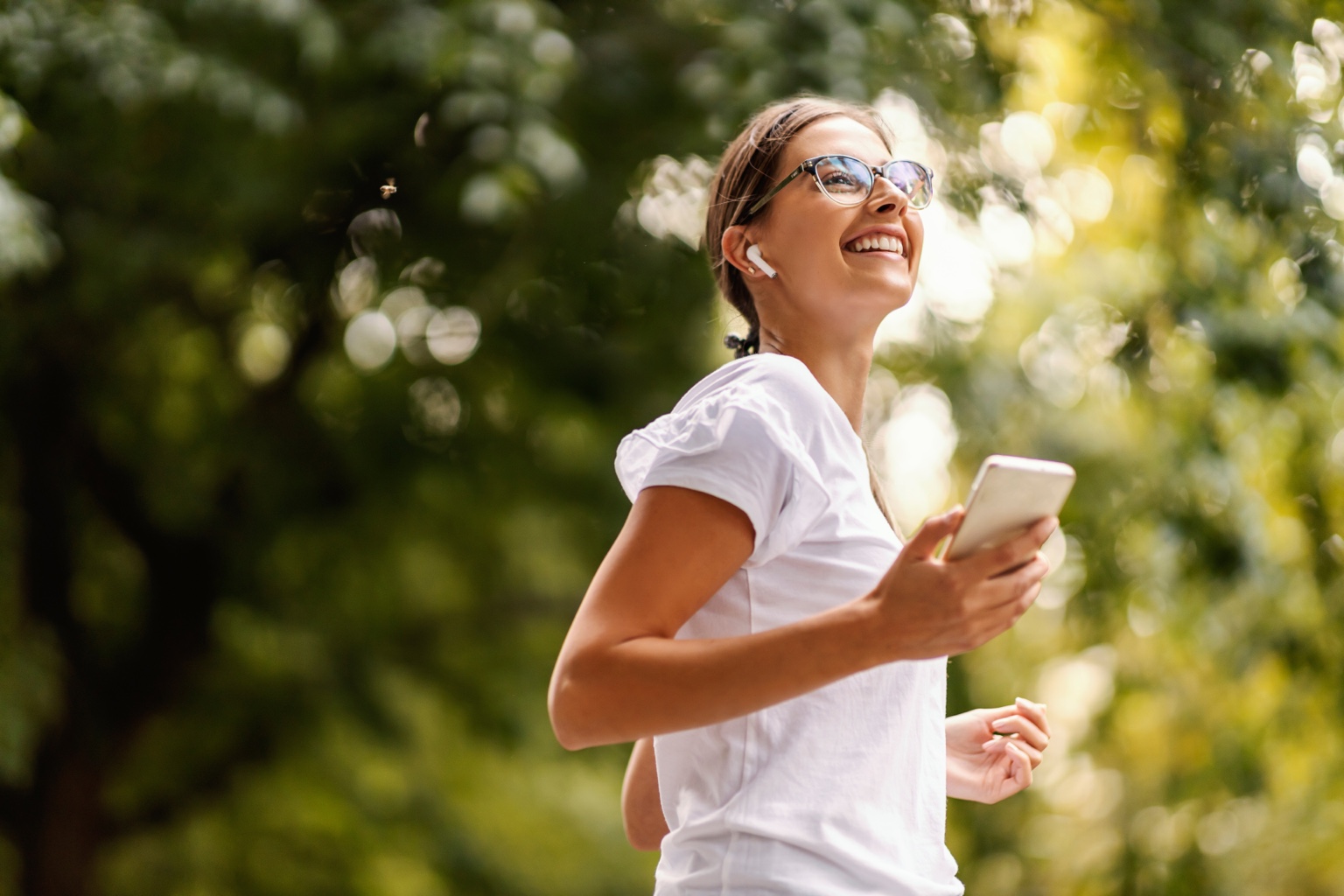Woman wearing eyeglasses while jogging outdoors